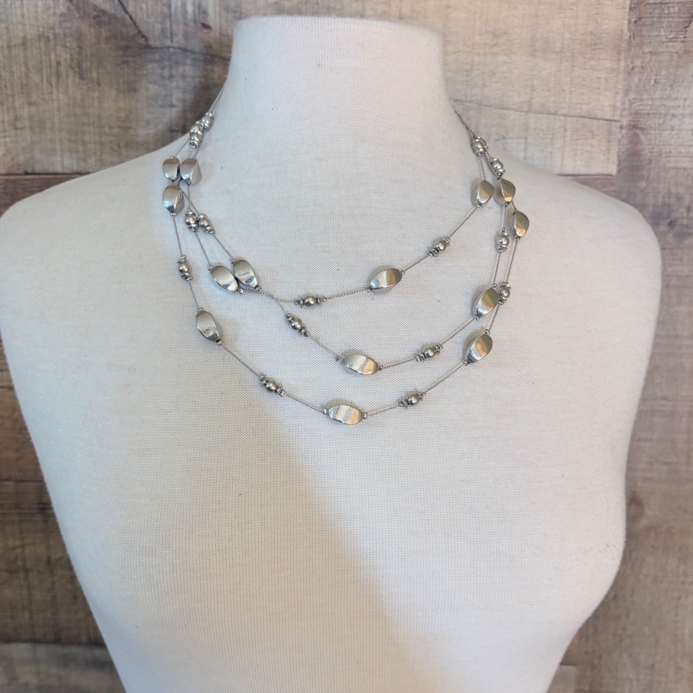 Silver Tone Multi Strand Layered Necklace with Oval Bead Accents